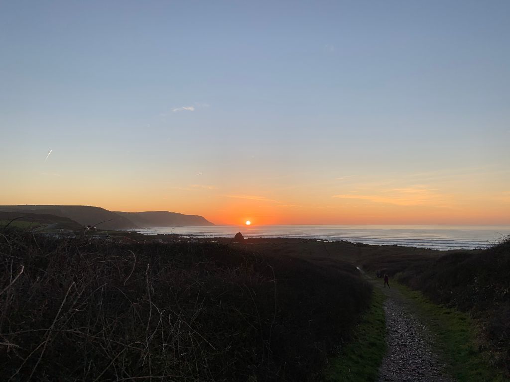 The sun setting over the Atlantic at Widemouth Bay